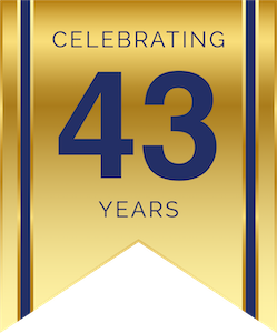 Gold ribbon badge reading Celebrating 43 Years